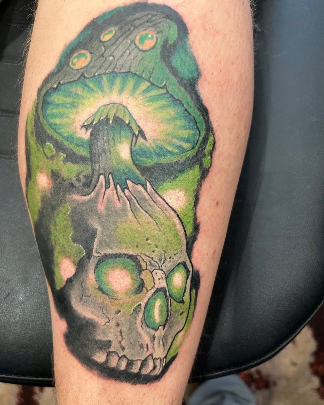 Green mushroom and skull color tattoo