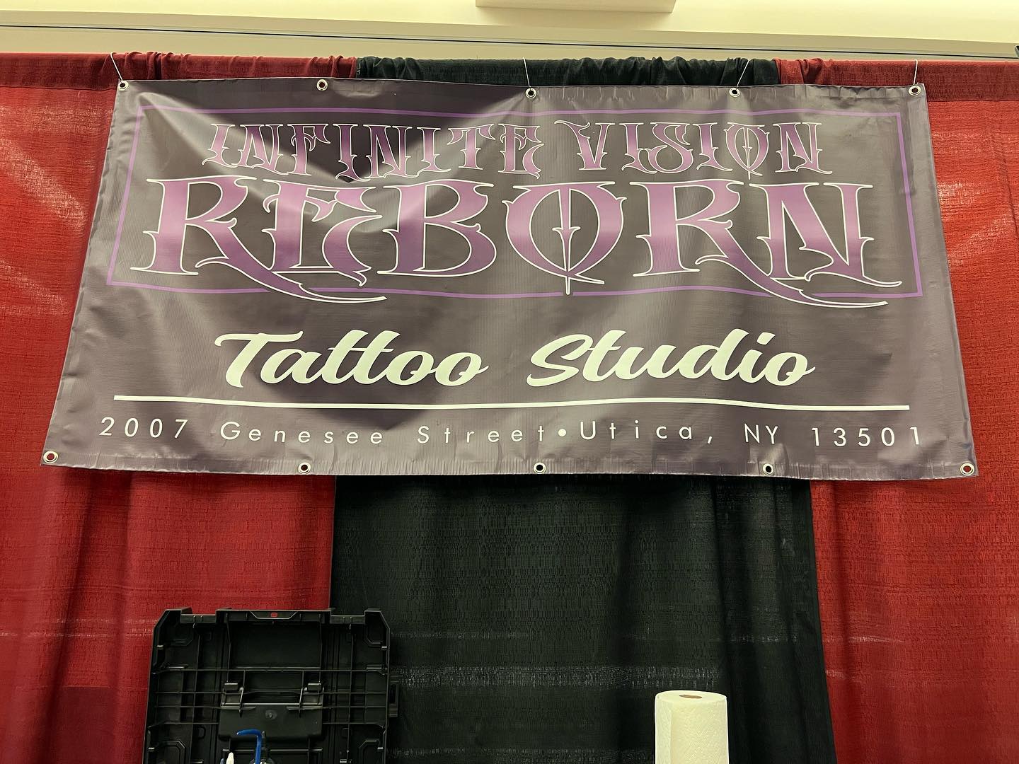 Infinite Visions Reborn banner at the Saratoga Tattoo Expo